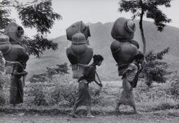 Central Java, Women carrying huge earthen jars, Indonesia