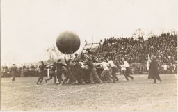 Students Hoisting Large Ball in the Air