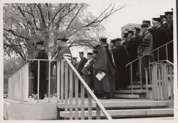 Cornell president James A. Perkins (left) on Olin Library terrace at Centennial celebration