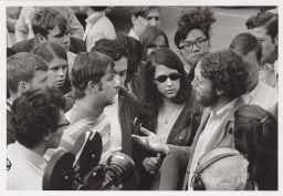 Group of students speaking in front of a television camera.