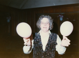 Woman playing instrument at a party