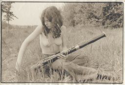 Photograph of Lindsay Cooper and a bassoon in a field