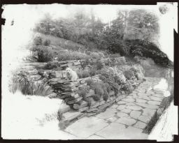 Rock garden wall with terrier