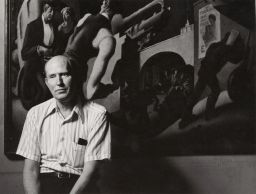 Archie Ammons sitting pensively in front of Depression-era painting