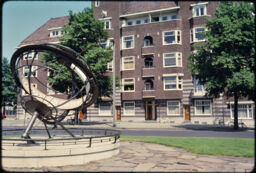 Sun dial with housing in the background (Amsterdam, NL)
