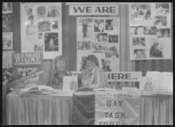 Women with National Gay Task Force display