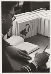 Student at a desk in the Africana Center Library
