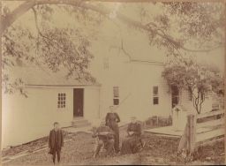 Joel Olcott, Nellie Olcott, and Clara Herring Olcott standing in front of Olcott farm house.