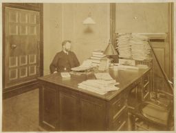 Man sitting at a large desk