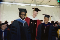 President Frank H. T. Rhodes posing with graduates at Cornell Commencement