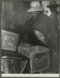 Woman carrying cans and distaff