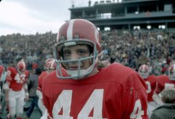Ed Marinaro (No. 44) close-up on field, in helmet