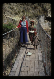 mahilaharu ra bachha jholunge pul tardai (महिलाहरु र बच्चा झोलुङ्गे पुल तर्दै / Women and Child Walking Across the Suspension Bridge)