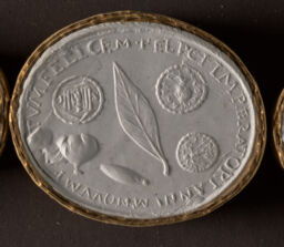 A Feather, Fig, and Date Surrounded by Three Images