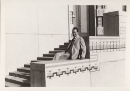 Clarence S. Stein on steps of Wichita Art Museum.