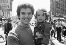 Rolando Arroyo and child at street festival, Third Ave. Hub, Bronx
