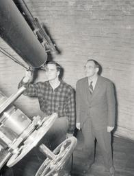 Student uses telescope with Physics professor John Millis