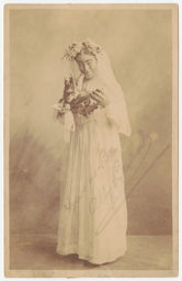 Female impersonator as Edwardian bride