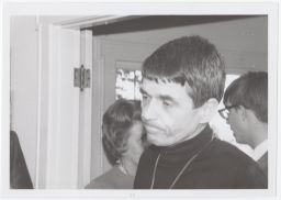 Daniel Berrigan looking ambivalent