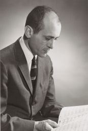 William W. Austin Prof. of Musicology portrait, reading a score