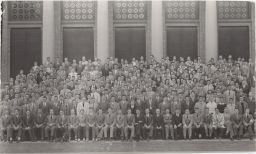 Hotel School students and faculty group portrait in front of Bailey Hall