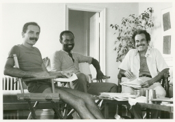 Smiling group of men sitting together