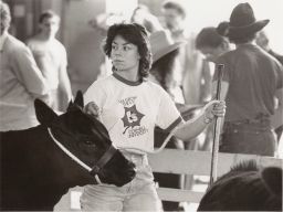 Woman With We Grow the Ivy T-shirt at Live Stock Show