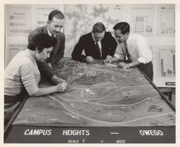 City and Regional Planning students and instructor with a model of Campus Heights, Owego, NY.